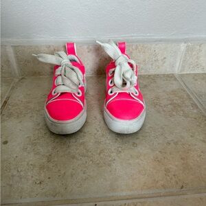 Kid’s vibrant pink Christian Louboutin sneakers